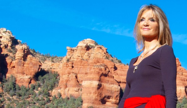 blonde woman with the sedona red rocks in the background