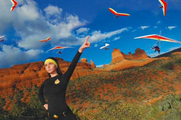 Brunette woman commanding paragliders